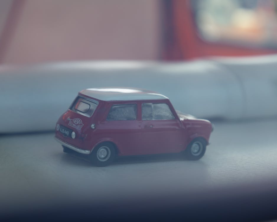 Foto profissional grátis de brinquedo em miniatura, carro de brinquedo, carros de brinquedo