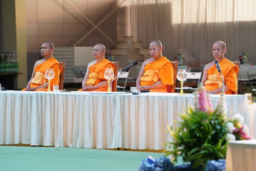 Monks Sitting at a Table