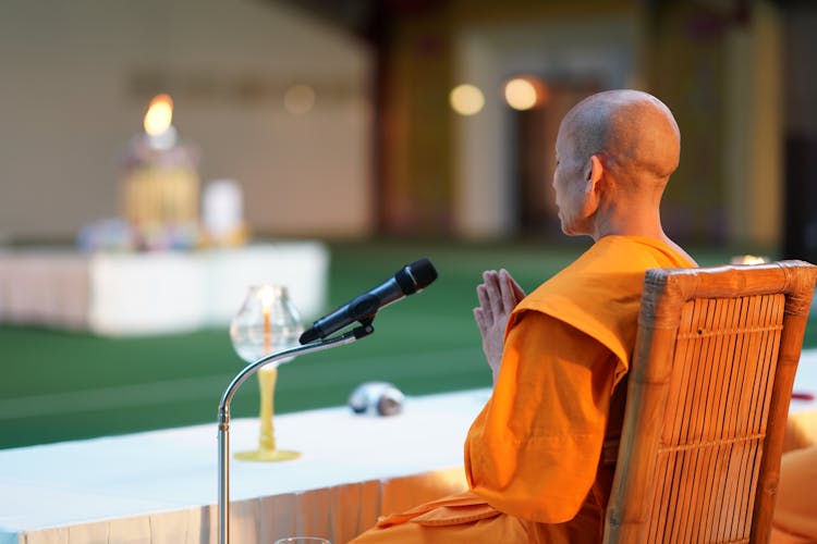 Monk Praying In Temple