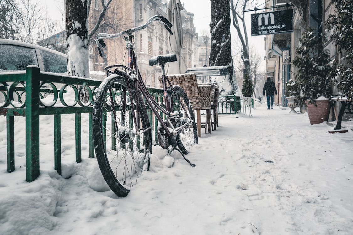 Free Bicycle on Snow Covered Street Stock Photo
