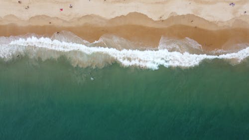Drone Shot of Ocean Waves Crashing on the Shore