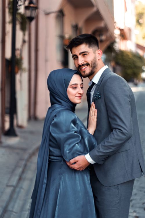 Free A happy couple standing together outdoors, exuding romance and love. Stock Photo