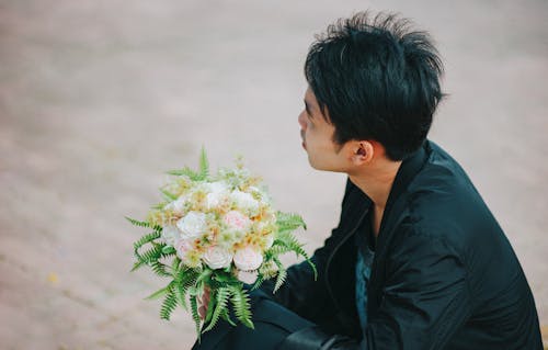 Free Person Holding Bouquet of Roses Stock Photo