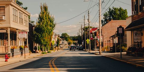Picturesque view of a quiet street in Manheim, PA with historic buildings and clear sky.