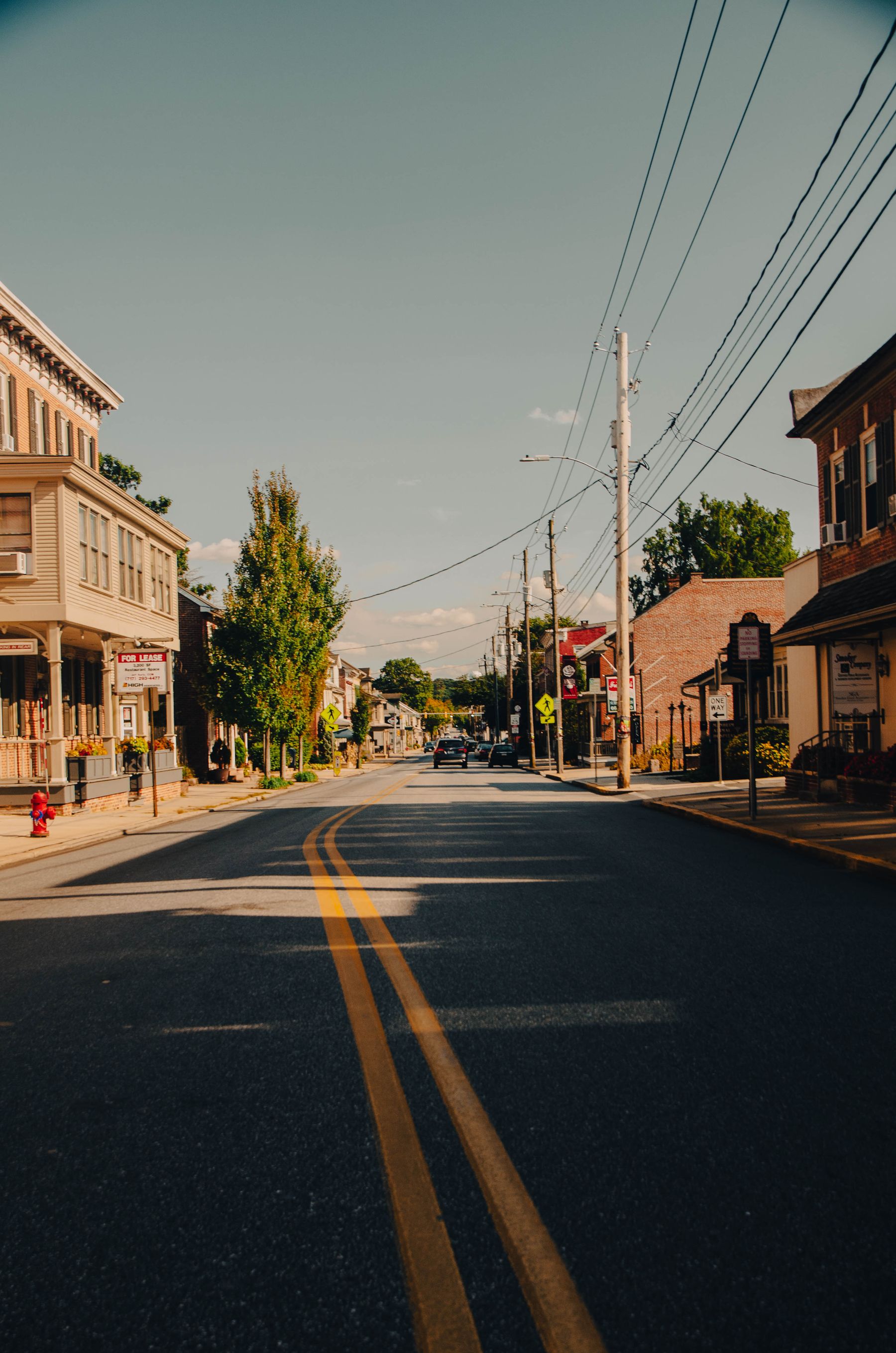 A historic small-town street with brick buildings