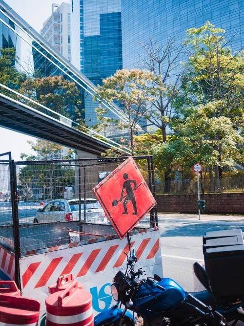 Free A busy city street featuring traffic signs, modern buildings, and urban infrastructure. Stock Photo