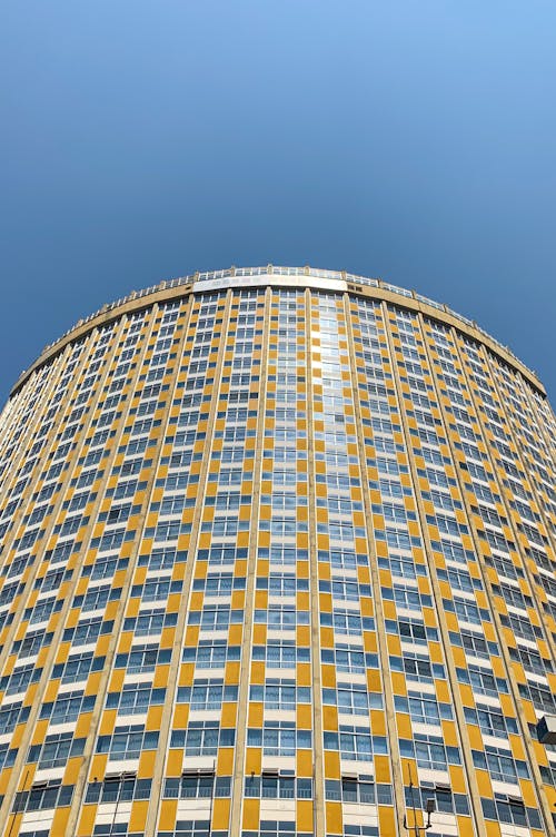 Free A Tall Glass Building Under Blue Sky Stock Photo