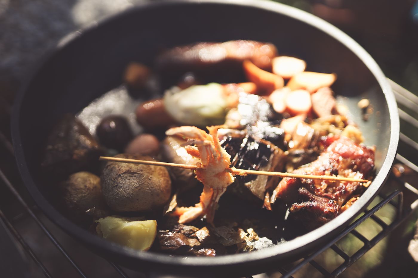 Grilled meat and vegetables in a cast-iron pan — photo by Huynh Van on Pexels