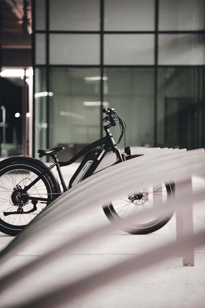 Sleek electric bike parked near contemporary building at night