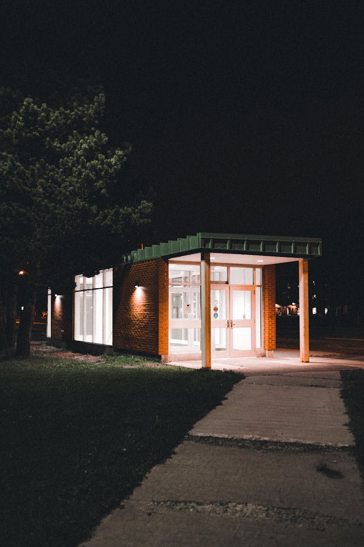 Building And Sidewalk At Night