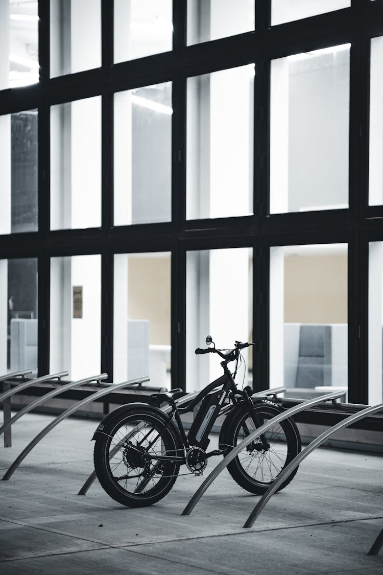 A Bicycle Parked In A Bike Rack