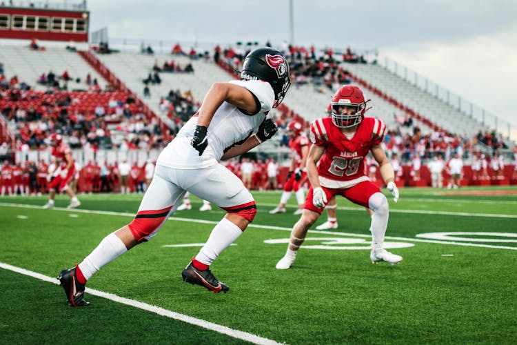 Football Players In Red And White Jersey Shirt And White Pants