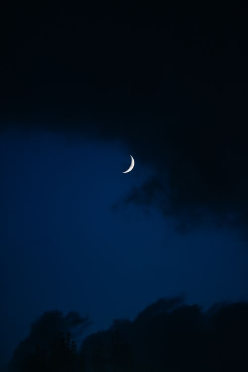 Free A tranquil crescent moon set amidst a dark blue night sky in Istanbul, Turkey. Stock Photo