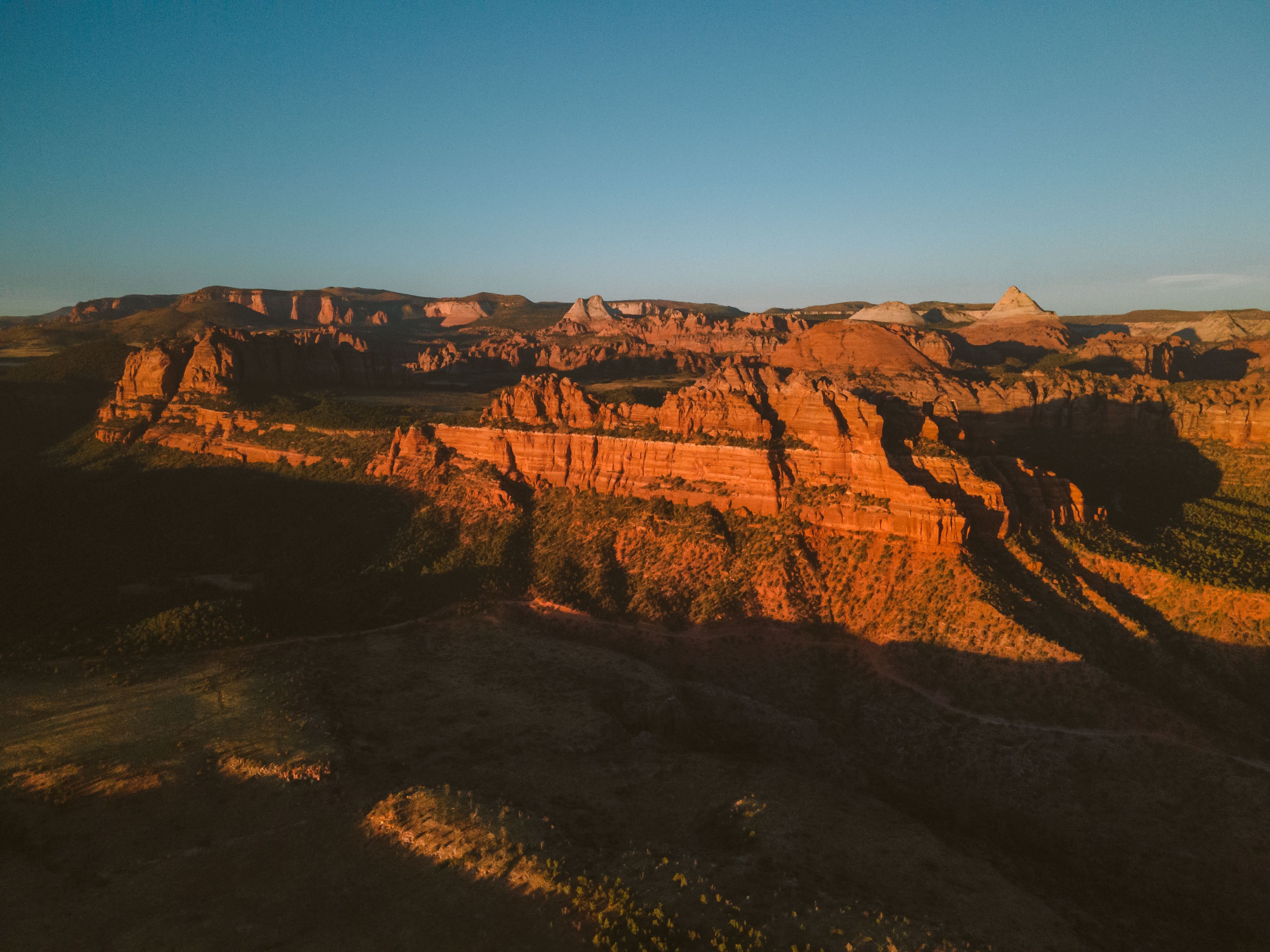 Breathtaking 35 Mile - Zion National Park Panoramic Helicopter Flight Review 2026 - A stunning aerial view of Utah's red rock formations glowing at sunset.