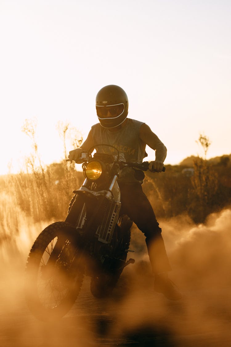 Man In Black Helmet Riding A Motorcycle 