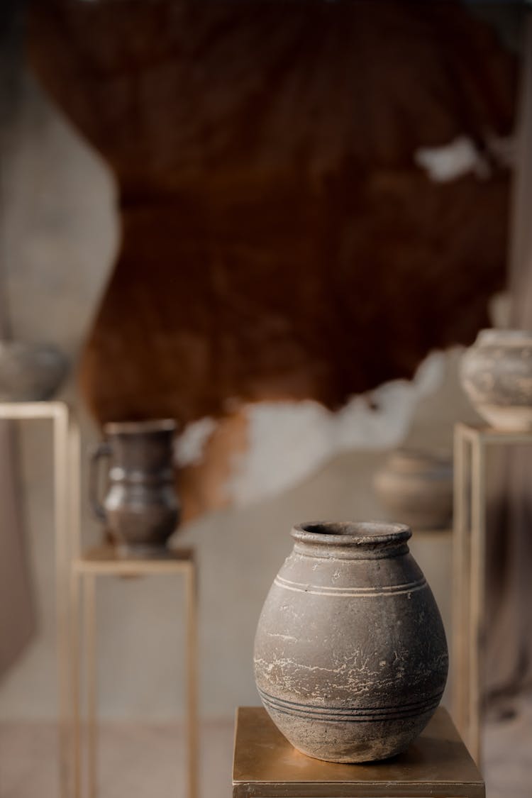 Brown Jar On Gold Surface 