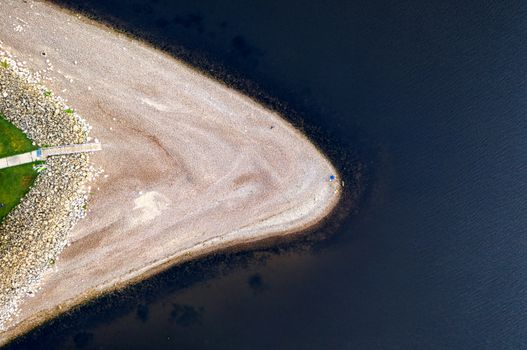 Stunning aerial photo of Lake City shoreline with pristine beach and deep blue water.