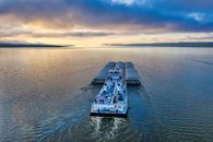 A Barge with Shipments Cruising Across the Ocean