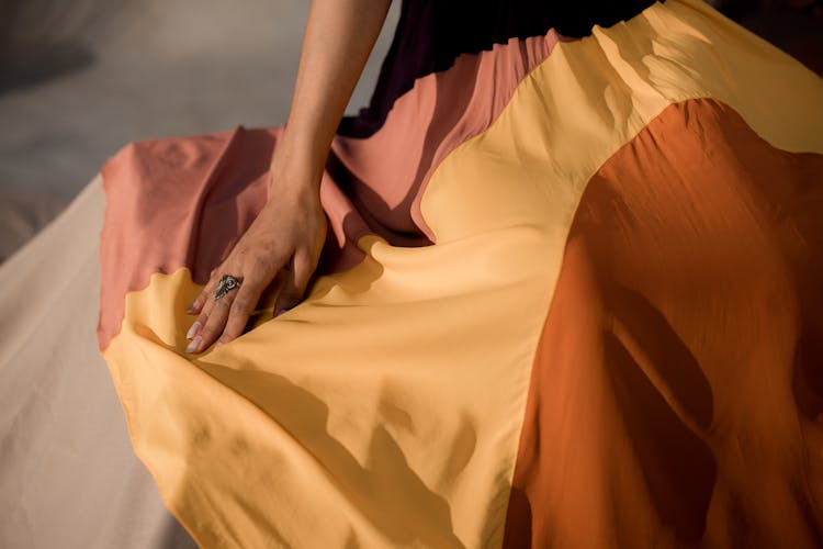 A Woman Wearing A Colorful Long Skirt