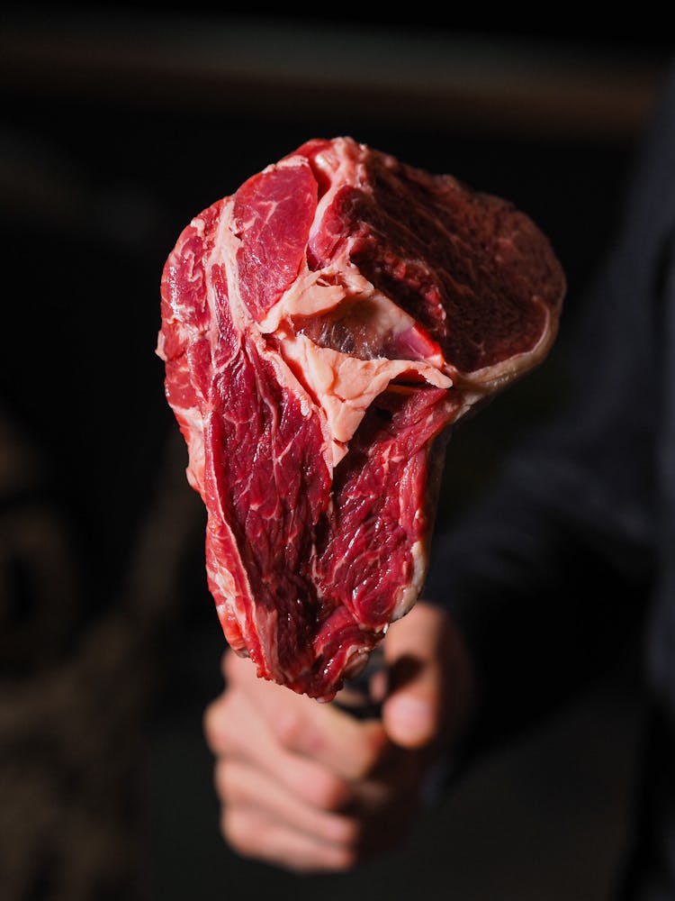 Man Holding Raw Beef 