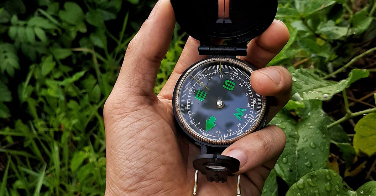 Guy Using A Compass Man Holding a Compass · Free Stock Photo