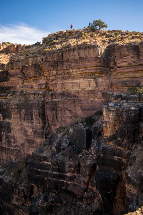 Free Man Standing on Cliff Stock Photo