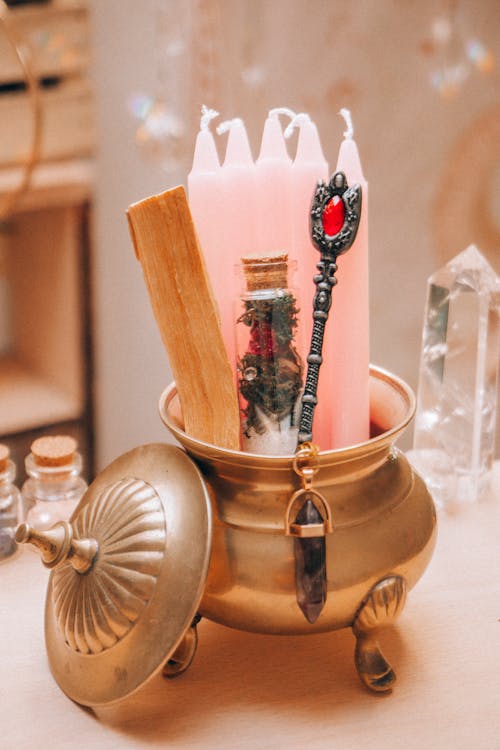 Golden Container with Wax Candles, Spoon and Vial