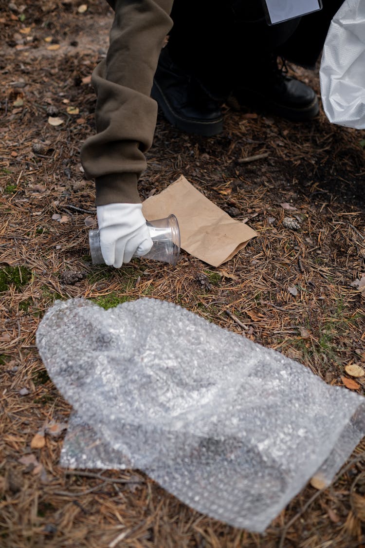 A Person Picking Up Trash