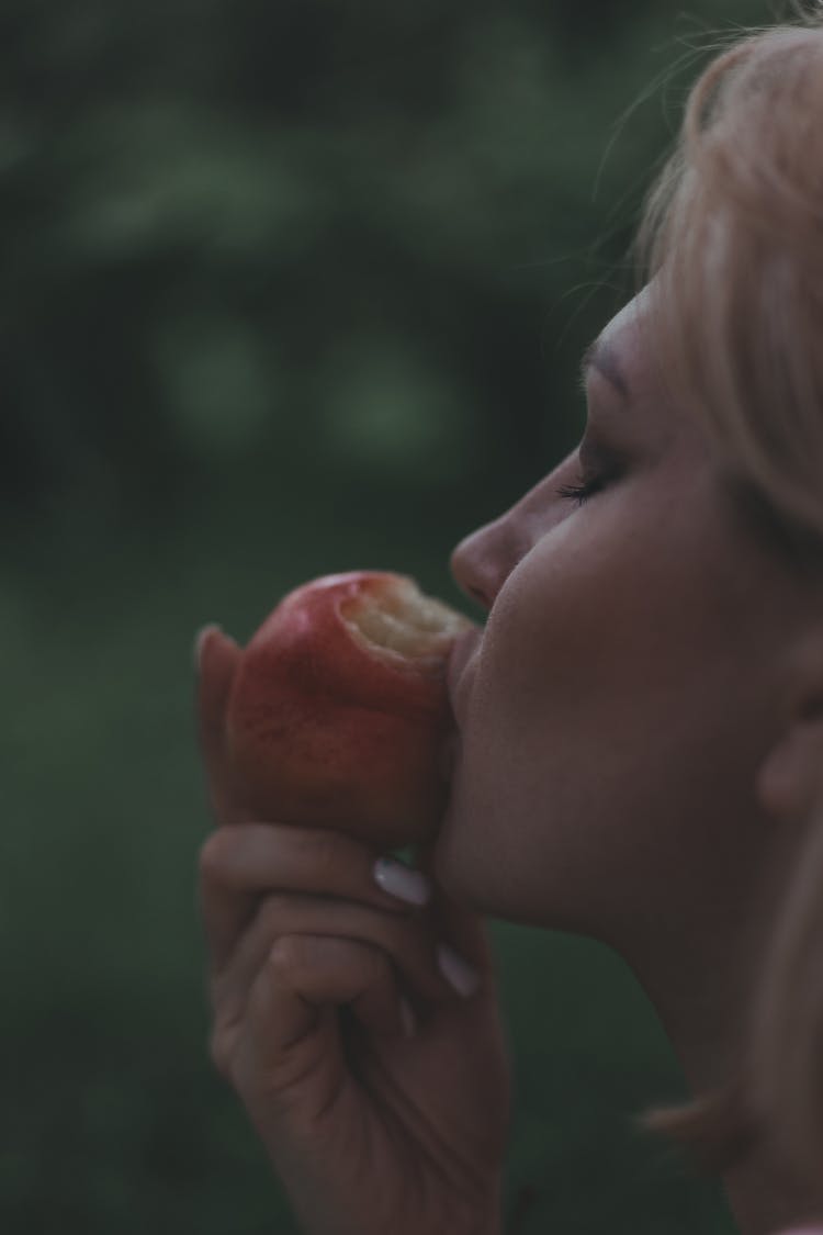 Woman Eating Apple