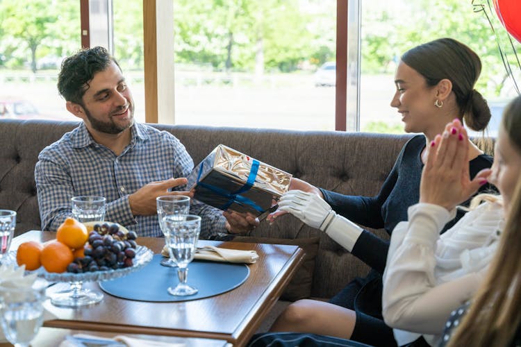 A Woman Receiving A Gift