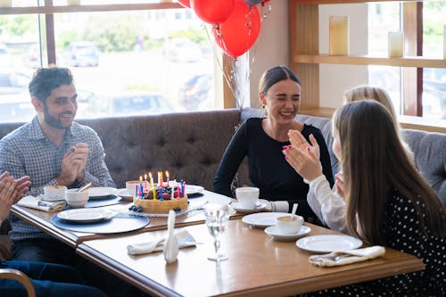 Free People Sitting at Table in the Restaurant  Stock Photo