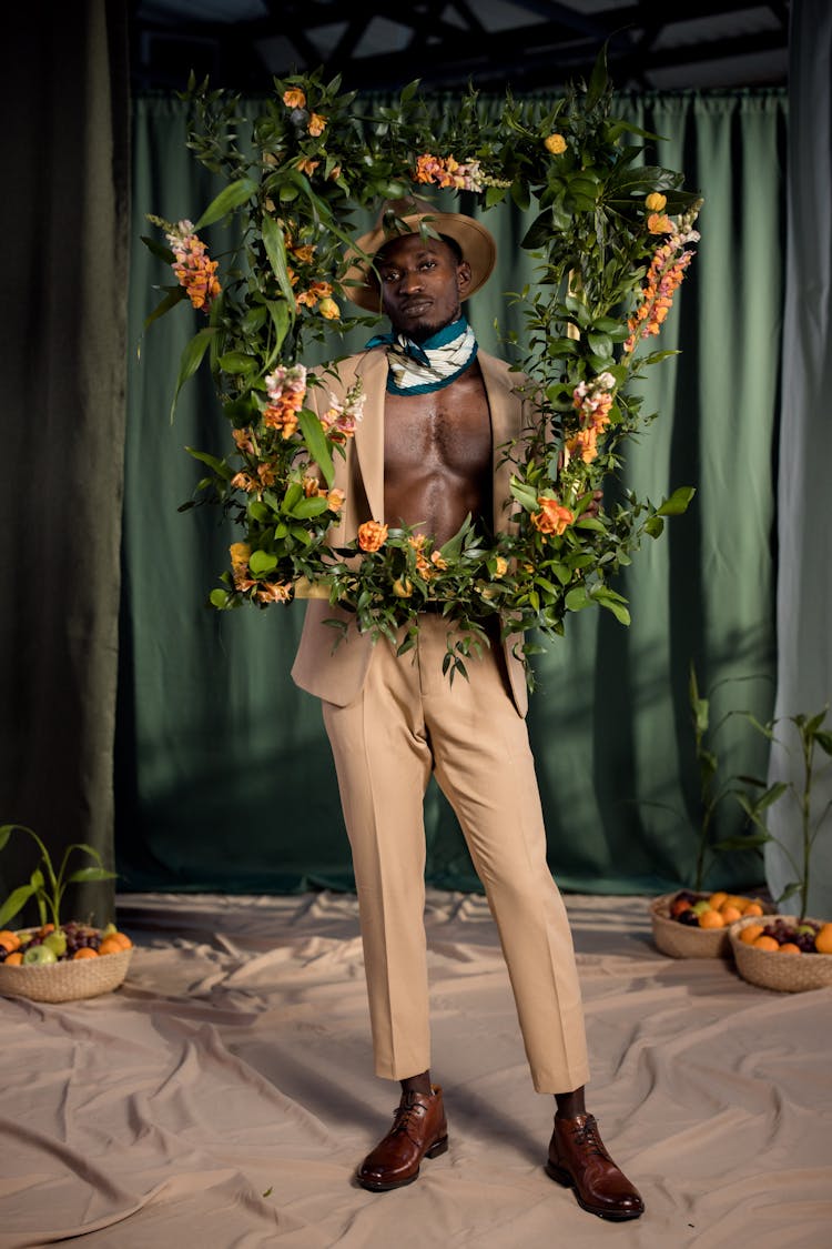 A Man Holding A Flower Laced Frame