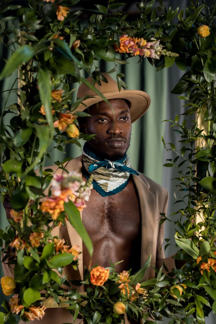 A Man Behind A Floral Frame