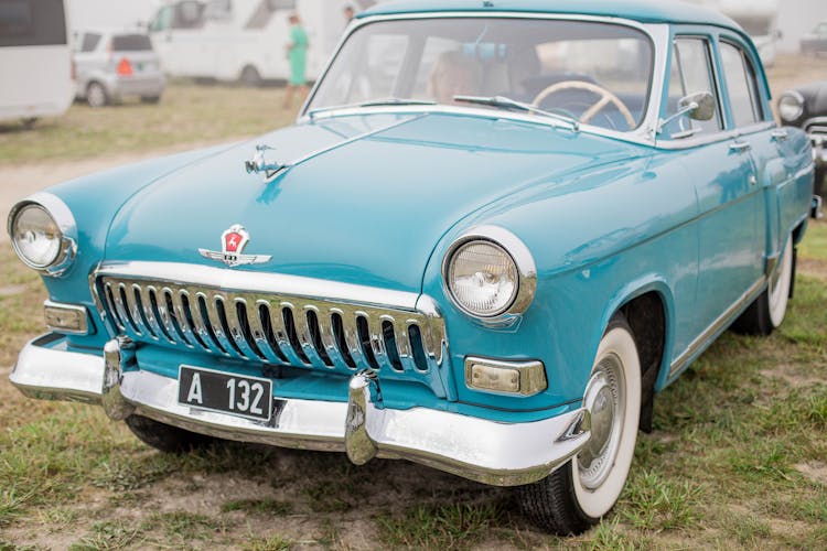 A Blue GAZ M21 Volga Parked Outdoors