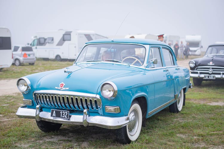 A Blue GAZ M21 Volga Parked Outdoors