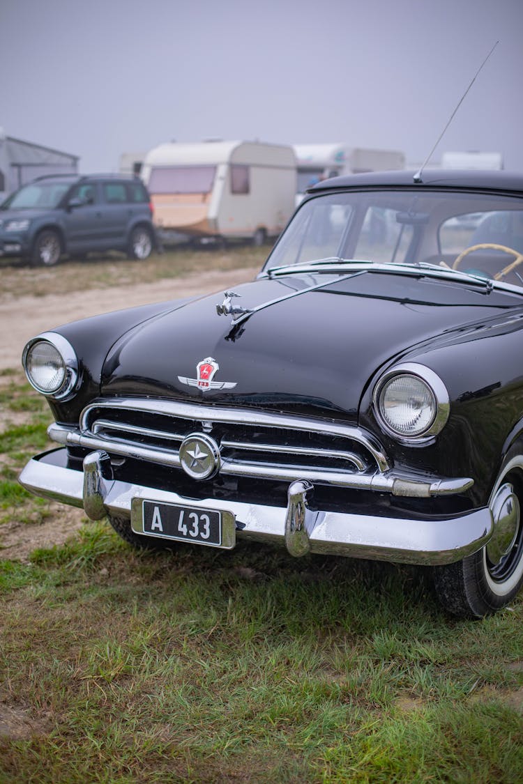 A Black GAZ M21 Volga Parked Outdoors