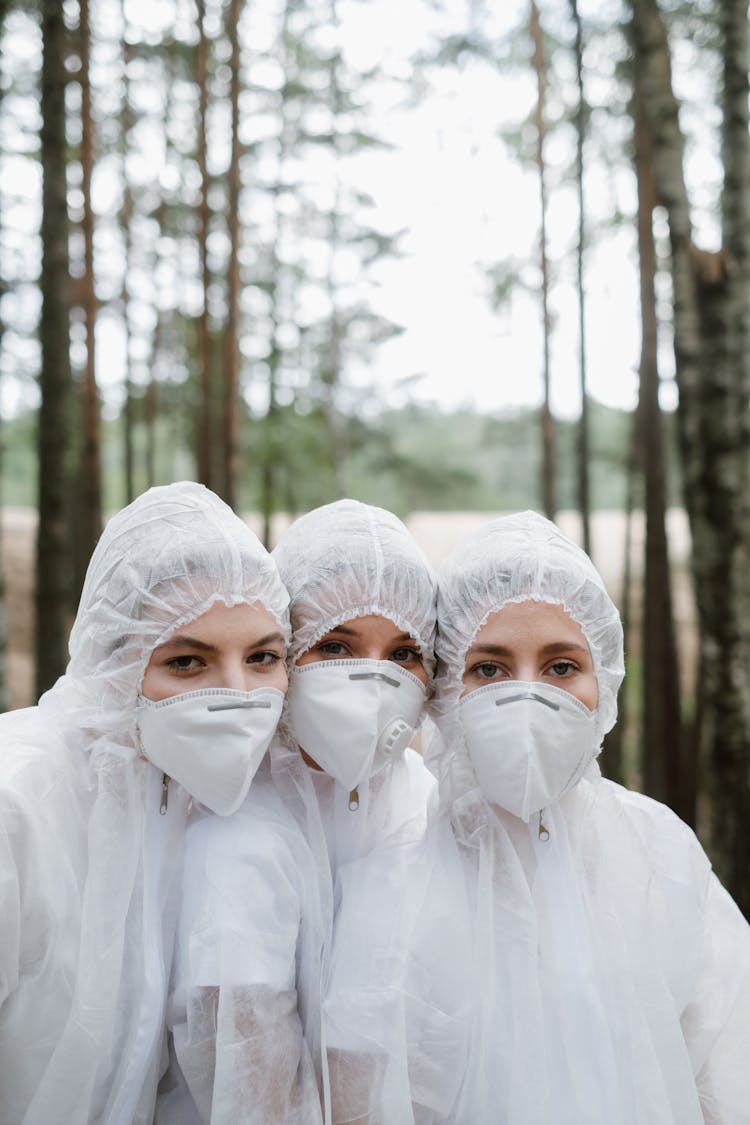 Women In Personal Protective Suit Ad Facemasks