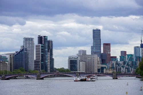 View of City Buildings Under a Cloudy Sky