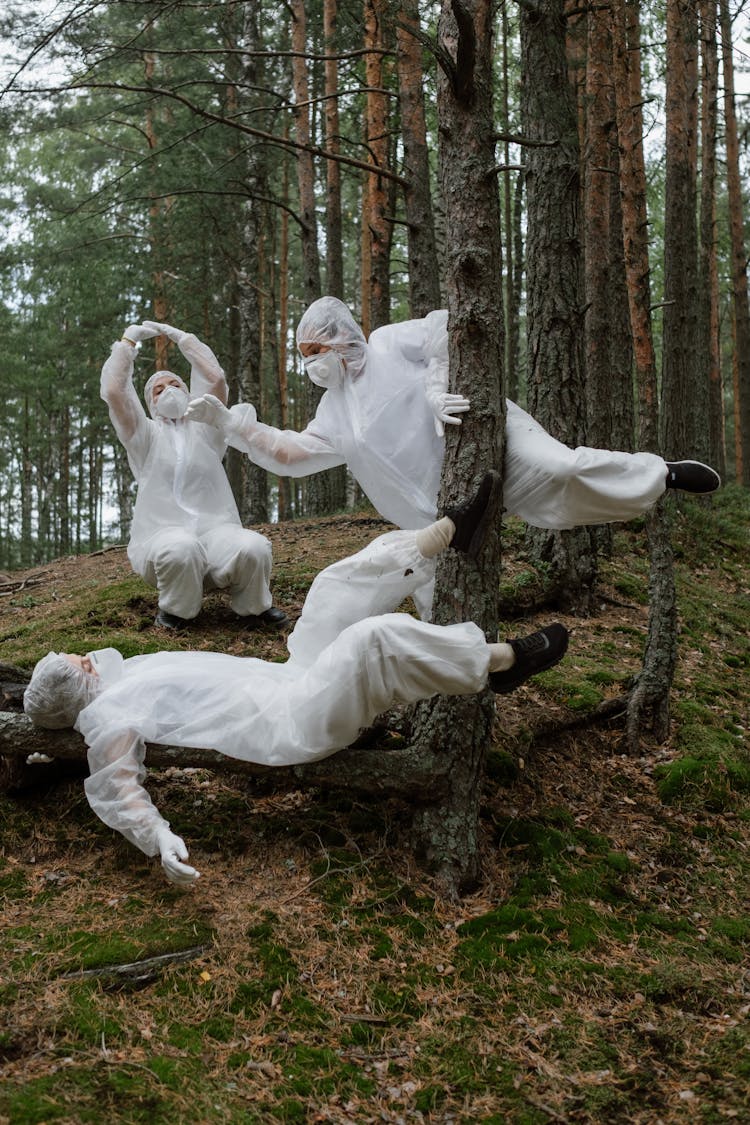 People Wearing White Hazmat Suits