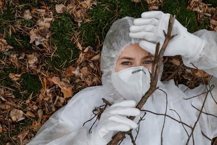 A Person Wearing White Hazmat Suit