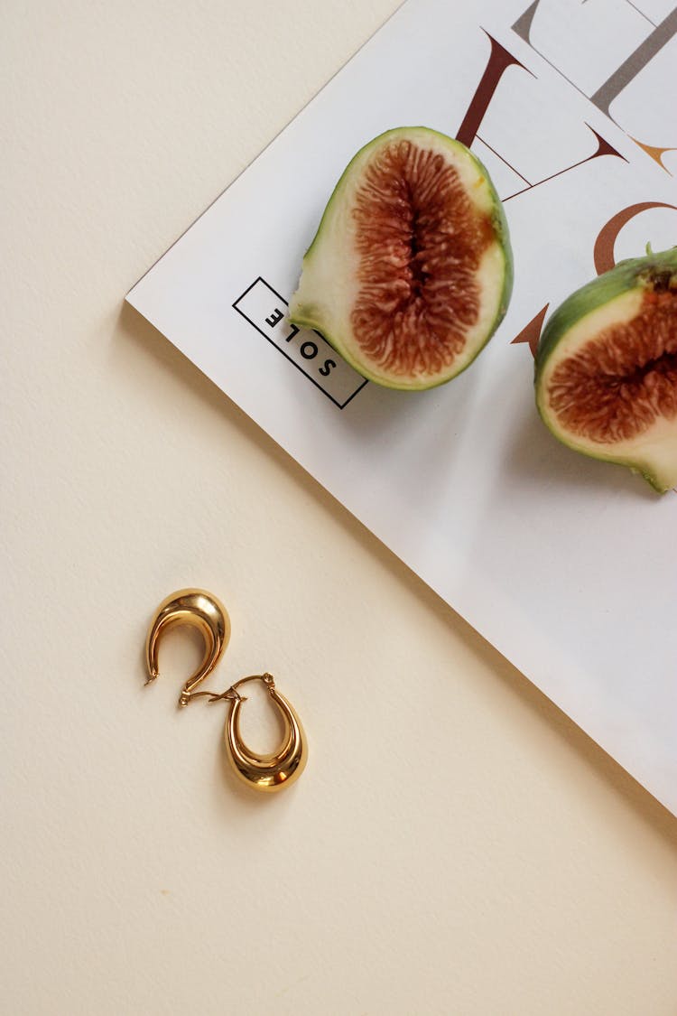 Golden Earrings And Cut Fruit