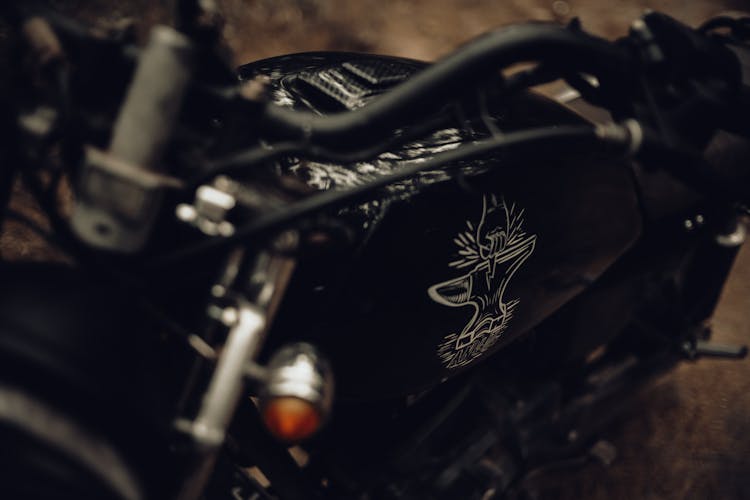 Close-up Of Black Motorcycle With Sticker 