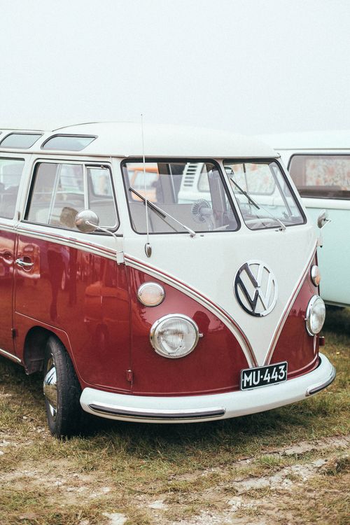 Free Classic Volkswagen van parked on grass with a vintage vibe. Stock Photo