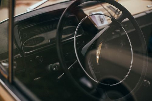Free Close-up of a vintage Lotus Elite dashboard and steering wheel with a classic design. Stock Photo