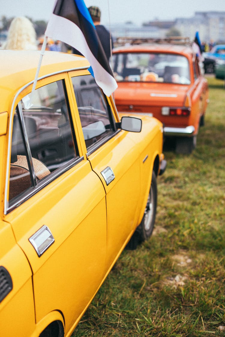 Yellow Classic Car With A Flag 