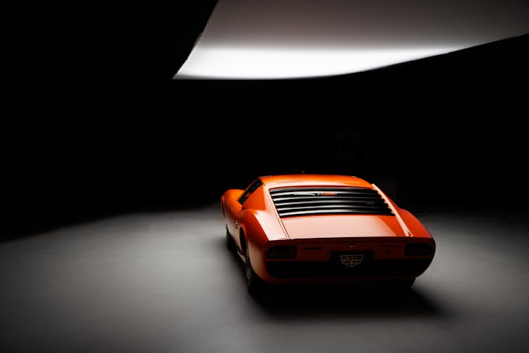 Orange Sports Car Inside A Studio