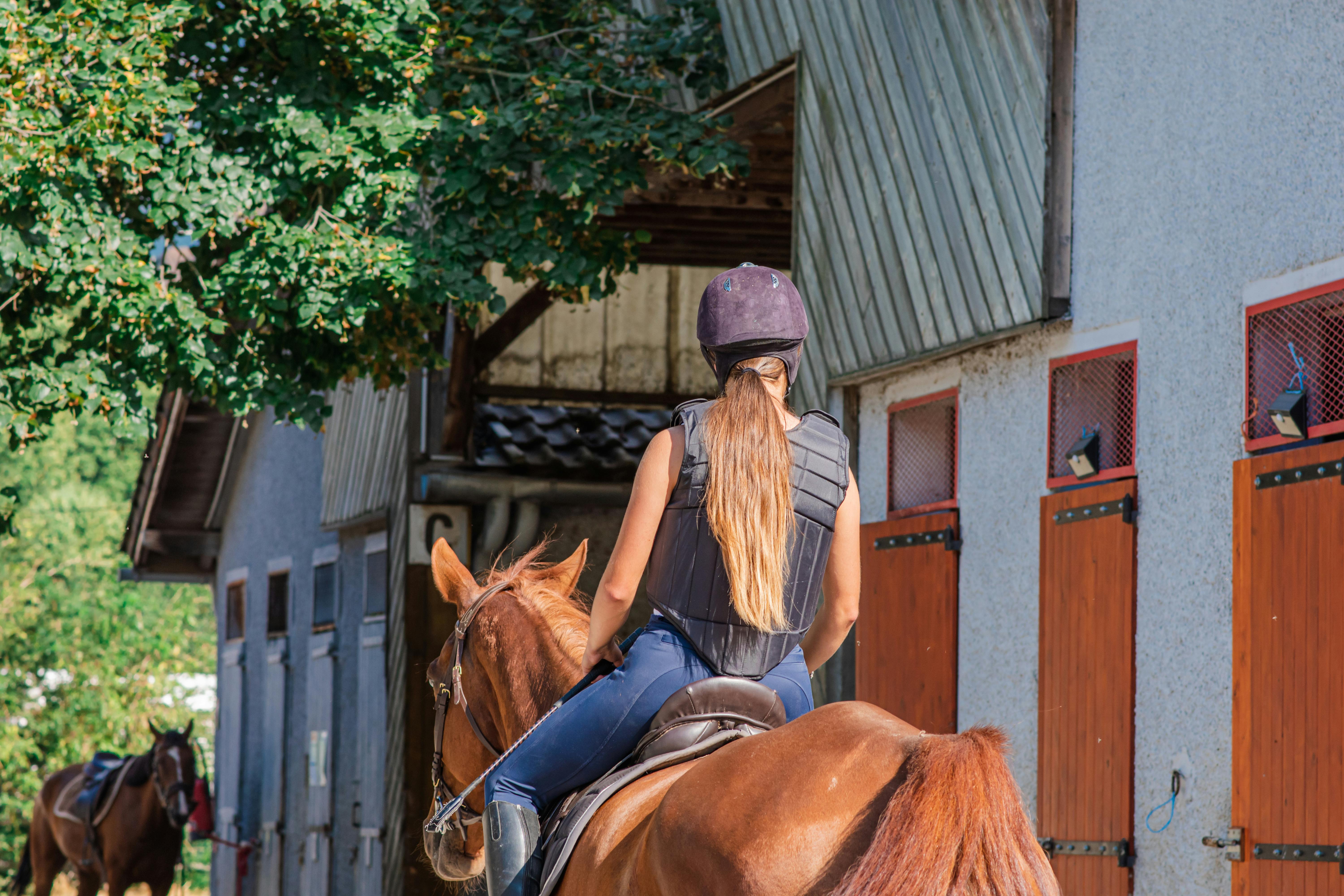 Person at home working remotely with a blanket and tissues while sick