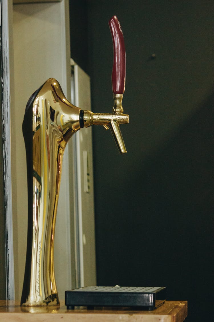 Close Up Of Golden Faucet