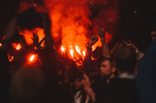 Free Group of People Gathering Near Bonfire Stock Photo