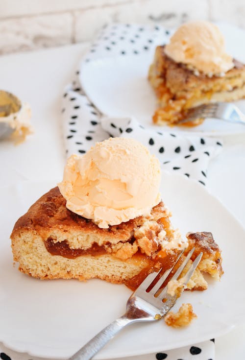 Shallow Focus of Pumpkin Pie on White Ceramic Plate 